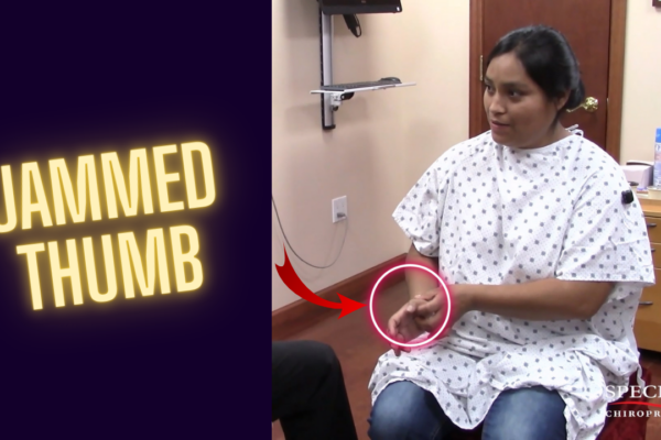 Female patient unable to extend her jammed thumb back due to a freak injury, showing visible limitation before chiropractic adjustment